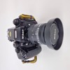 Kamera Nikon i fotoväska